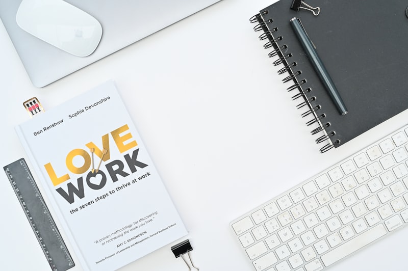 Professional development planning with notebook and keyboard representing CPD balance