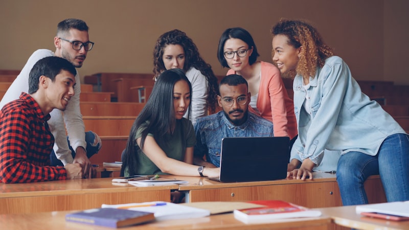 Diverse group of professionals gathered for a study group discussion